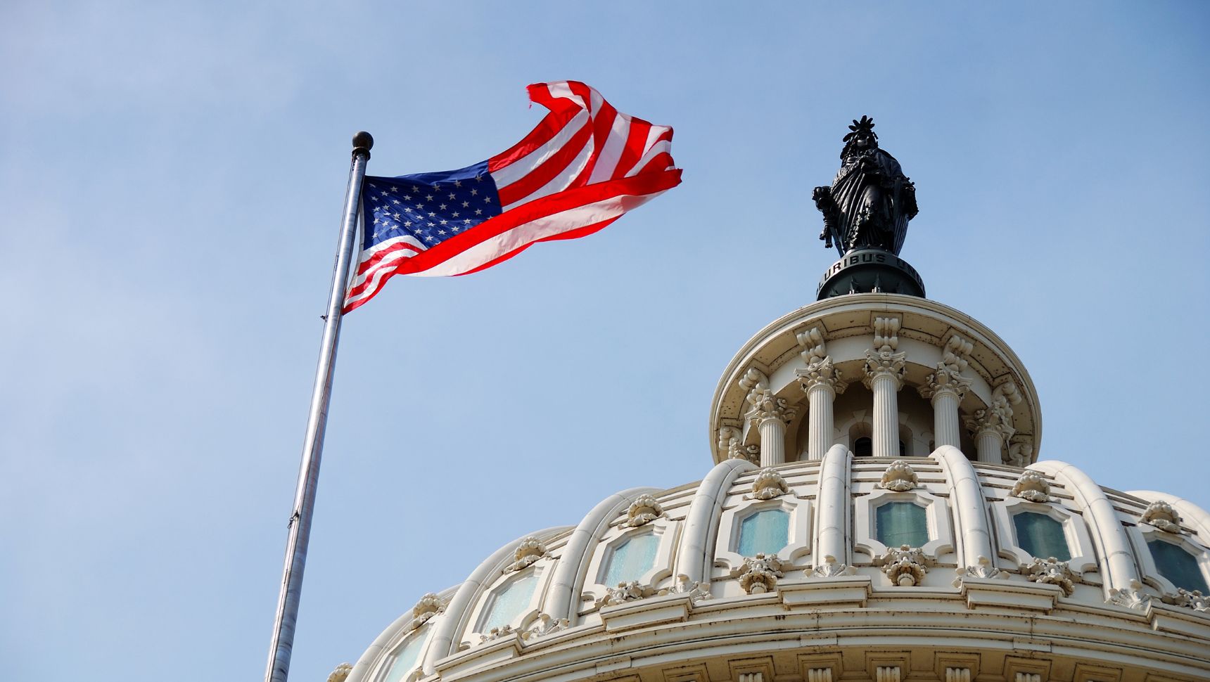 flag flying over Capitol building